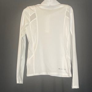 Ariat equestrian women’s quarter zip white riding shirt with sheer air holes.